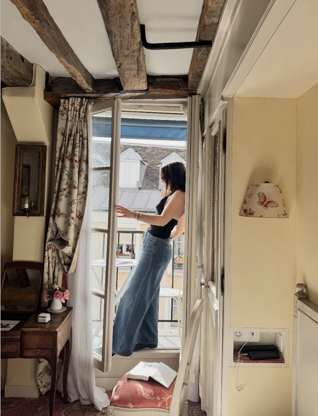 Rosa at the open window of her room at Hotel Caron de Beaumarchais in Paris